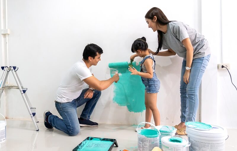 family painting the wall home decor